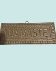Plaque murale doré NAMASTE