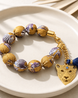 EXVOTOBYNATGAP - BRACELETS BOULES TISSUS AVEC TETE DE TIGRE - 3 COULEURS