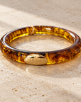 GAS BIJOUX - BRACELET JONC TURNER EN ACÉTATE AMBRE - MÉTAL DORÉ