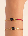 BE MAAD - Bracelet poisson beige/obsidienne dorée
