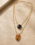 GAS BIJOUX - COLLIER SCAPULAIRE SERTI SCARABEE DORÉ - ÉMAILLÉ ORANGE ET PIERRE ONYX