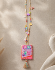 COLLECTION TOPAZE - SAUTOIR "LOVE" ROSE FUCHSIA A POMPON