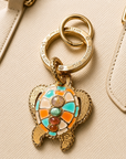 GAS BIJOUX - PORTE CLÉS DORÉ - TORTUE E-MAIL TURQUOISE, ROSE ET ORANGE