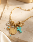 MADAMIRMA - SAUTOIR CHARMS DORÉS - CROIX TURQUOISE