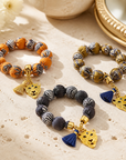 EXVOTOBYNATGAP - BRACELETS BOULES TISSUS AVEC TETE DE TIGRE - 3 COULEURS