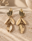 JORGINA - BOUCLES D'OREILLES DORÉES AVEC FEUILLES AVEC CRIXTAUX blanc