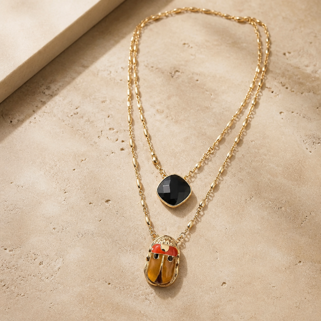 GAS BIJOUX - COLLIER SCAPULAIRE SERTI SCARABEE DORÉ -  ÉMAILLÉ ORANGE ET PIERRE ONYX