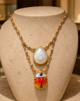 GAS BIJOUX - COLLIER SCAPULAIRE SERTI SCARABÉE DORÉ - EMAIL ORANGE ET BLANC ET NACRE BLANCE