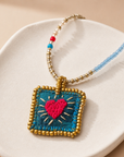 COLLECTION TOPAZE - SAUTOIR "COEUR SACRÉ" TURQUOISE ET OR