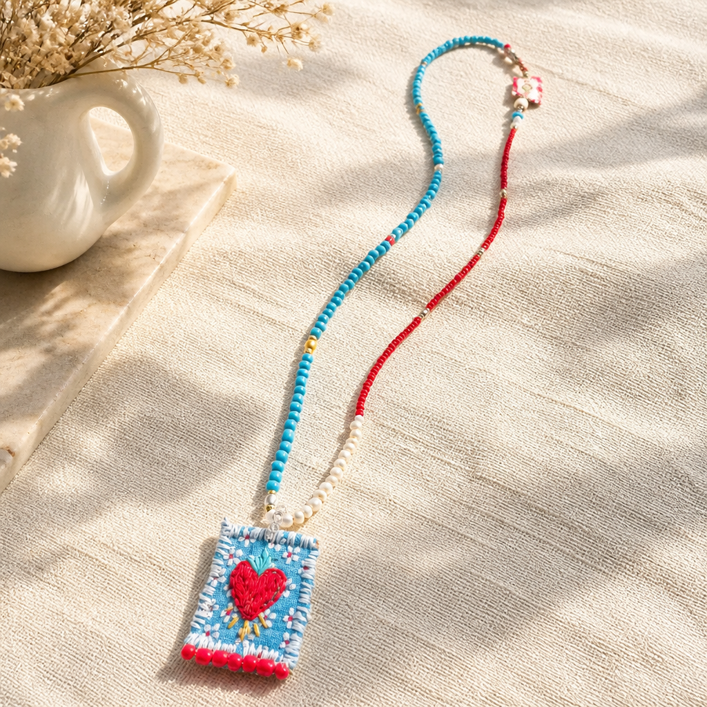 COLLECTION TOPAZE - SAUTOIR "COEUR FLÈCHES" BLEU CIEL ET CORAIL