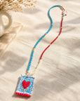COLLECTION TOPAZE - SAUTOIR "COEUR FLÈCHES" BLEU CIEL ET CORAIL
