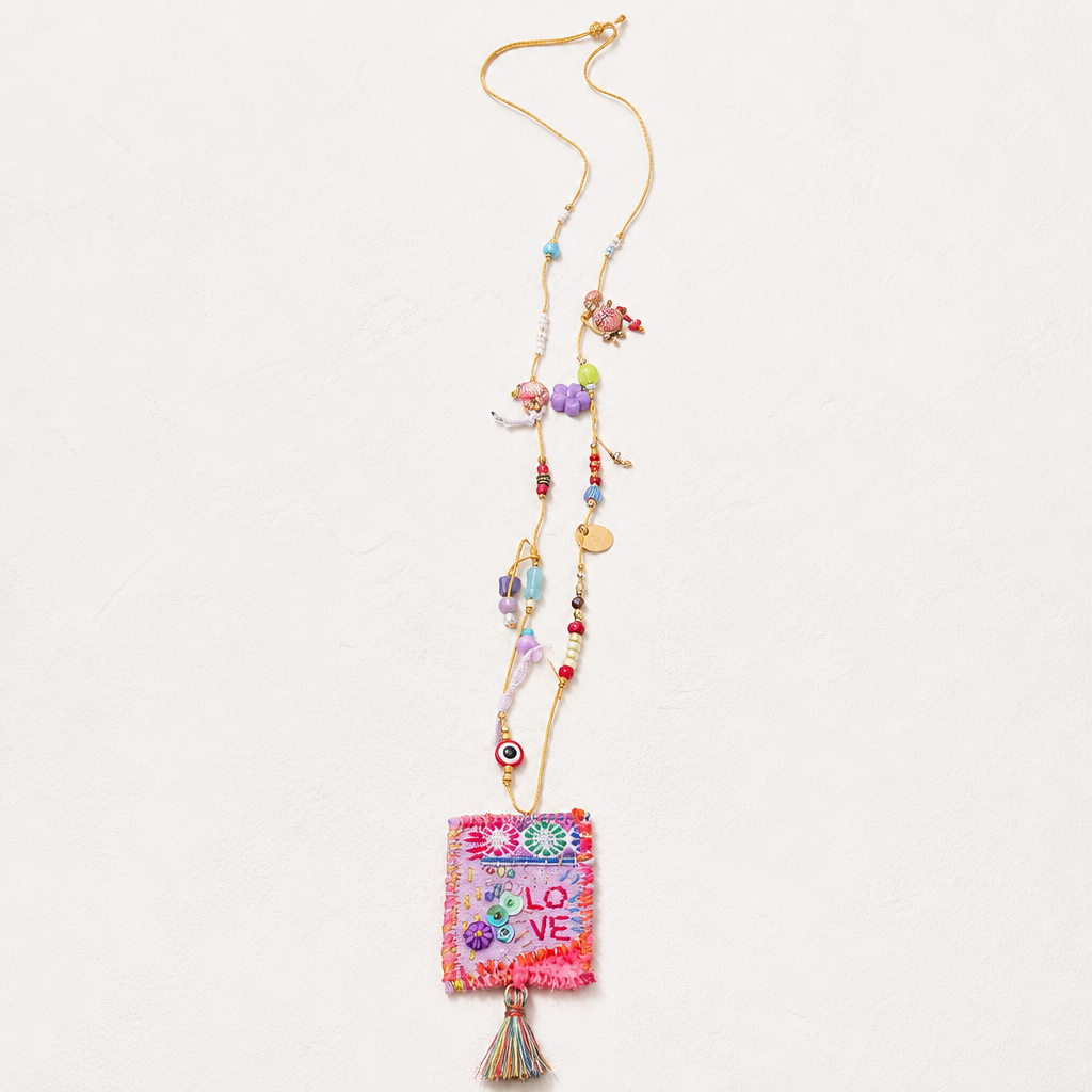 COLLECTION TOPAZE - SAUTOIR "LOVE" ROSE FUCHSIA A POMPON