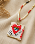 COLLECTION TOPAZE - SAUTOIR "TRUST" COEUR OEIL BLANC ET ROUGE